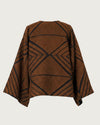ARAÑA handwoven brocaded jacket flat lay, back view, burnt sienna with bold black geometric brocade pattern — Traces of the World
