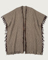 SANTOS handwoven artisan wool poncho flat lay, natural undyed wool with fringe detail — Traces of the World
