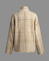 Rear view of the DESI jacket solo, highlighting the handmade fringes throughout the seams and the unique Khadi weave.